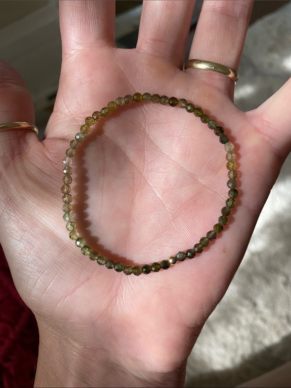 Faceted tourmaline bead bracelet with 14k yellow gold knot ball